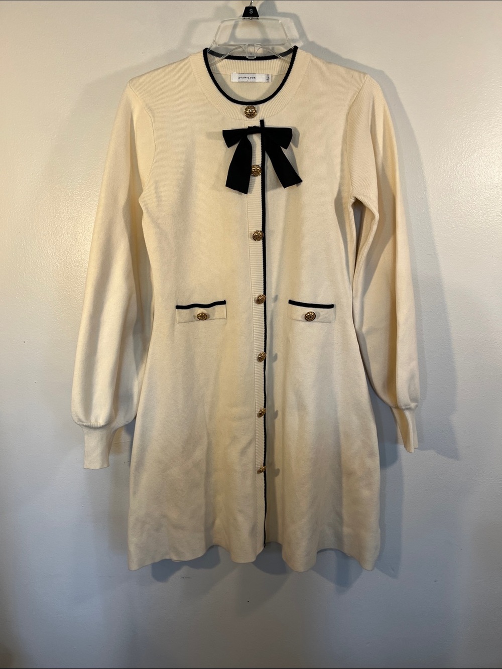 Avantlook Cream Long Sleeve Knit Dress with Black Trim and Bow Accent